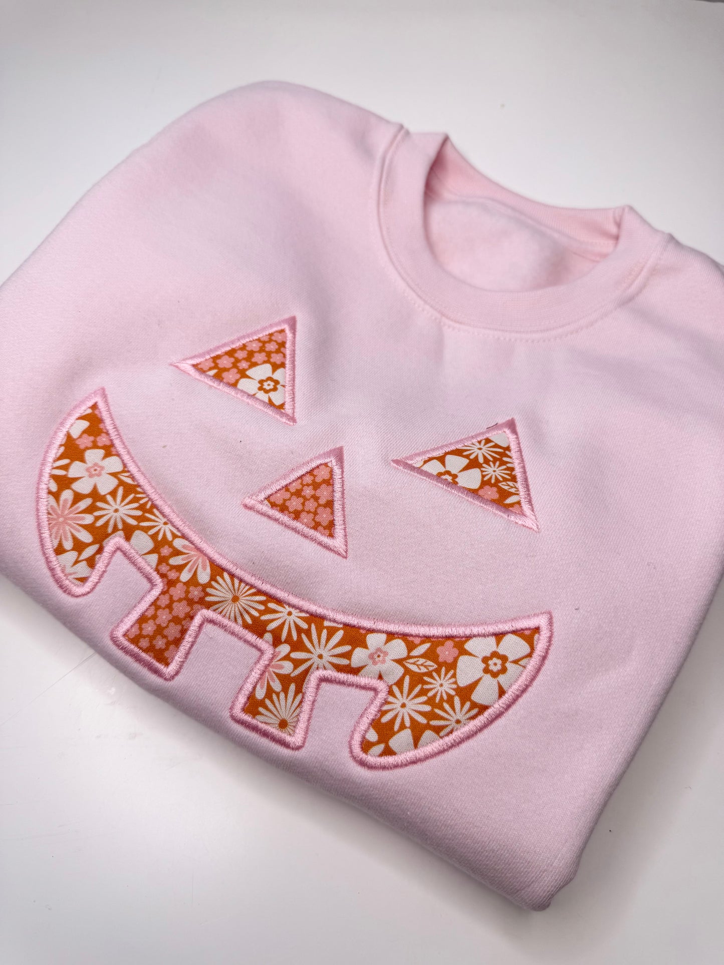 Pastel Floral Pumpkin Face Sweatshirt