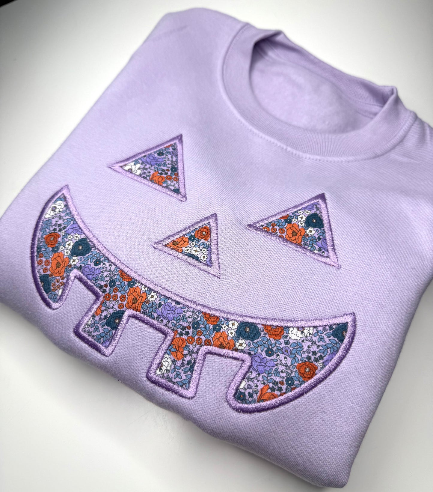 Pastel Floral Pumpkin Face Sweatshirt